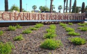 An old sign showcasing the Chandler Fashion Center project.